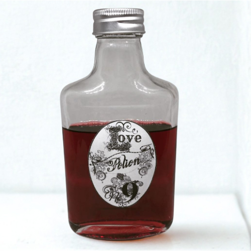 Small glass bottle containing red liquid with a decorative 'Love Potion 9' label on a white background.